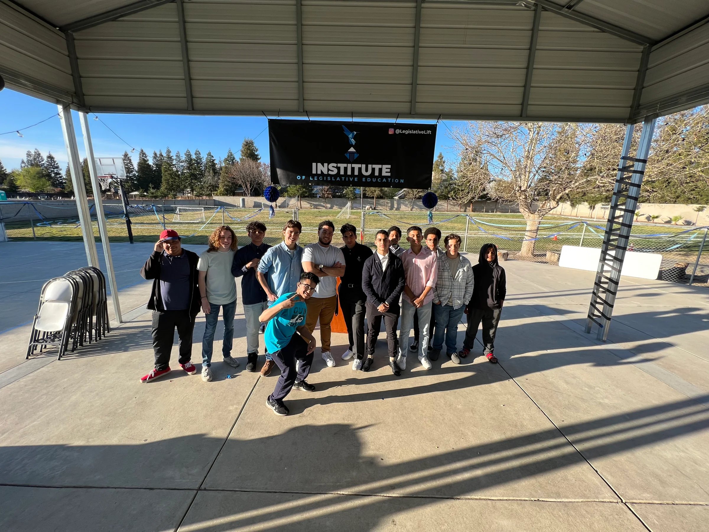 Legislative Lift volunteers posing together under the Institute of Legislative Education banner